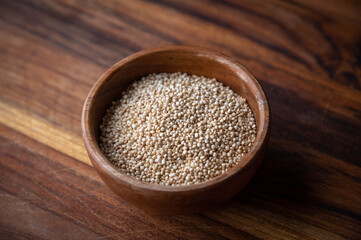quinoa in wooden small bowl