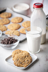 Fototapeta na wymiar oatmeal cookie with a glass of milk