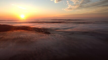 Fototapeta na wymiar sunrise over the fog Drone shot