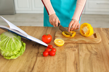 Young woman cooking in kitchen