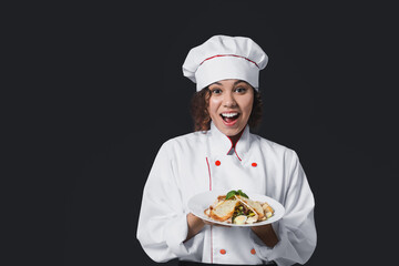 Female African-American chef with tasty dish on dark background