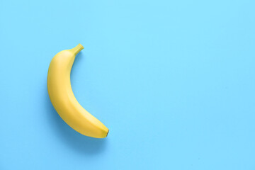 Ripe banana on color background