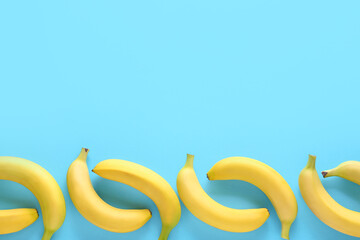 Ripe bananas on color background