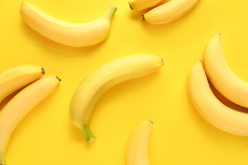 Ripe bananas on color background