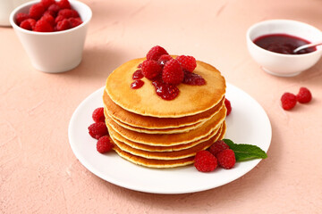 Sweet pancakes with berries on color background