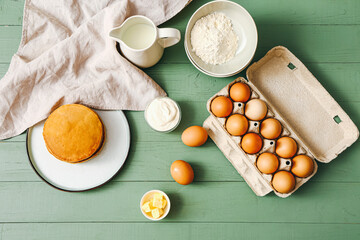 Tasty pancakes with ingredients on table