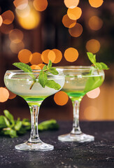 Glasses of fresh martini on table