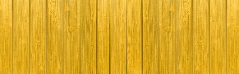 Panorama of Vintage yellow wood fence texture and seamless background
