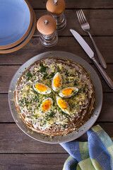 Layered liver cake with cheese, mayonnaise and dill. View from above, top studio shot