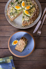 Layered liver cake with cheese, mayonnaise and dill. View from above, top studio shot