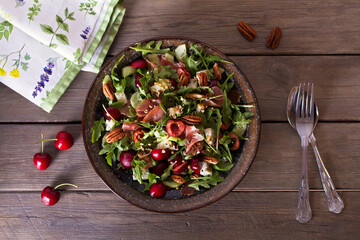 Strawberry and cured ham salad with gorgonzola cheese. Summer salad. View from above, top studio shot