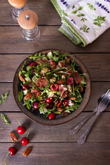 Strawberry and cured ham salad with gorgonzola cheese. Summer salad. View from above, top studio shot
