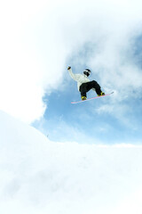 Naklejka na ściany i meble Male snowboarder in air