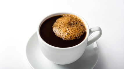black coffee in a coffee cup top view isolated on white background.