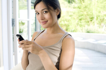 Woman text messaging on the mobile phone