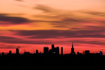 Obraz na płótnie Canvas Silhouette Buildings Against Sky During Sunset