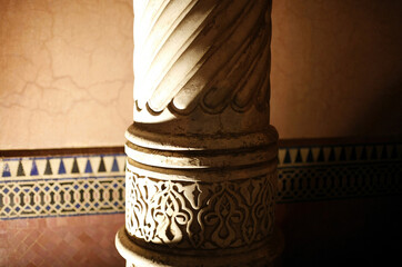 Close-up of scroll work on column