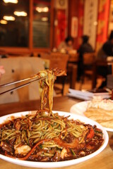 Close up of Jajangmyeon, Korean black bean sauce noodles at Korean restaurant, Busan, South Korea