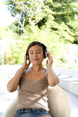 Woman listening to music on headphones