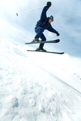 Fototapeta na wymiar Skier performing a jump