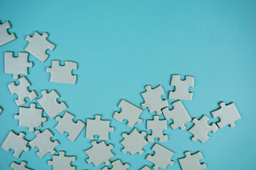 random white jigsaw puzzle incomplete concept on blue background