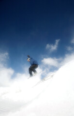 Naklejka na ściany i meble Male snowboarder in air