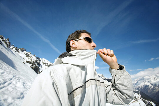 Man zipping up his jacket