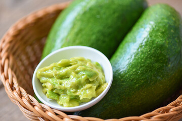 Avocado dip mashed on basket - Fruits healthy food concept