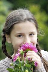 Girl smelling flowers