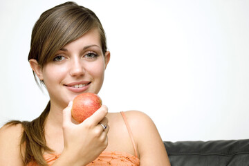 Girl holding a red apple