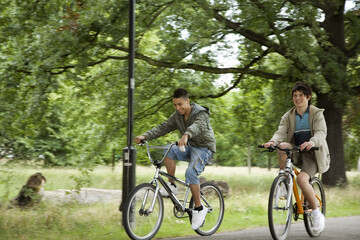 Fototapeta premium Boys cycling in the park