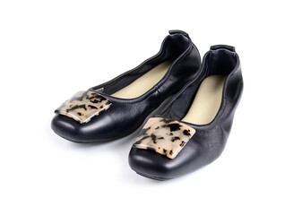 black ladies' flat shoes on white background.