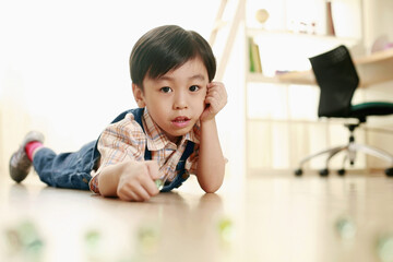 Boy playing marbles
