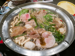 Boiled meat and vegetable in hot pot soup