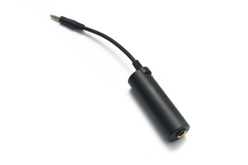 Close up guitar interface adapter for smartphone and tablet over white background.