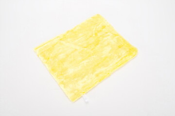 Yellow rag on a white background.