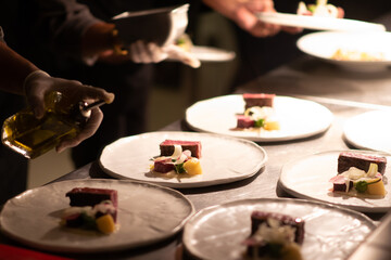 Busy commercial kitchen with team chef