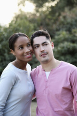 Fototapeta premium Man and woman smiling while looking away