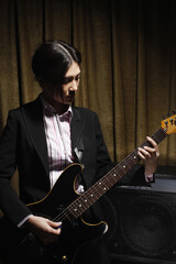 Obraz premium Young woman playing electric guitar