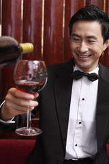 Man holding up wine glass