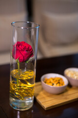 red rose in glass