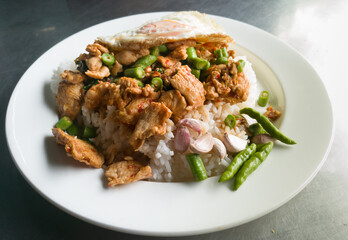 fried curry chicken with rice and fried egg