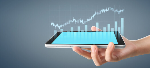 Graph growth and increase of chart positive indicators in his business, tablet in hand