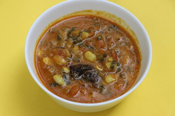 Alu wal chi Bhaji, Colocasia leaves and beans curry, authentic konkani maharashtraian dish, Indian traditional food