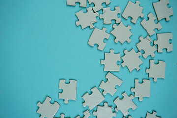random jigsaw puzzle incomplete concept on blue background
