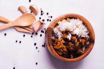 Garlic Pepper Chicken Fried Rice in Wooden Cups on White Background