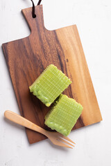 The cake is a layer of Pandan custard. Thai dessert