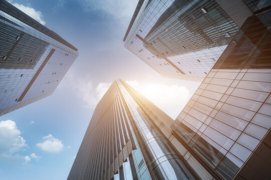 Fototapeta Modern tall buildings seen from below. Diminishing perspective