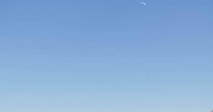 Panoramic tilt from the Jenner peak (1874m) revealing a paraglider in the sky.
