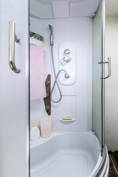 Empty Corner Rounded Shower Cabin With Closed Sliding Glass Door